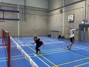 Hannah and Dan playing badminton